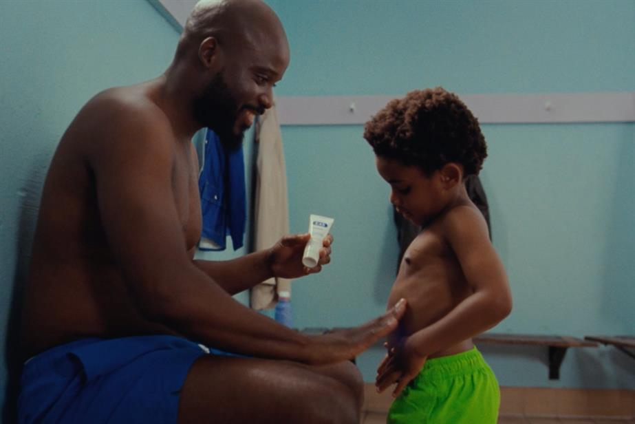 Father applying E45 to his son