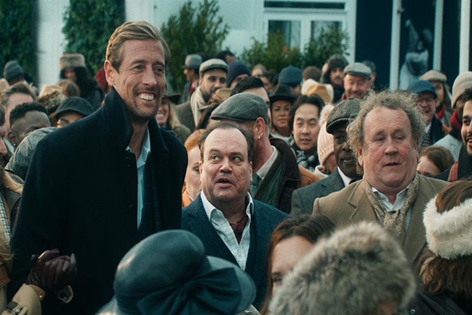 A still from the Cheltenham showing Peter Crouch, Shaun Williamson and Colm Meaney together in a crowd at the festival