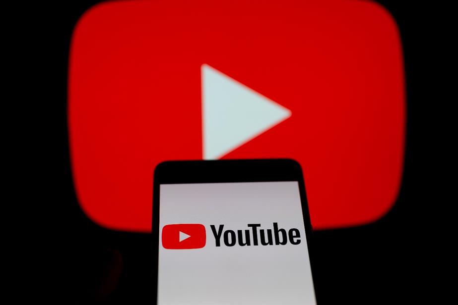 YouTube logo on a phone in front of its "Play" button icon